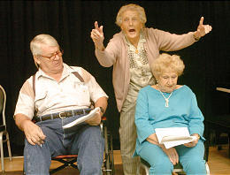 Three participants rehearse a scene