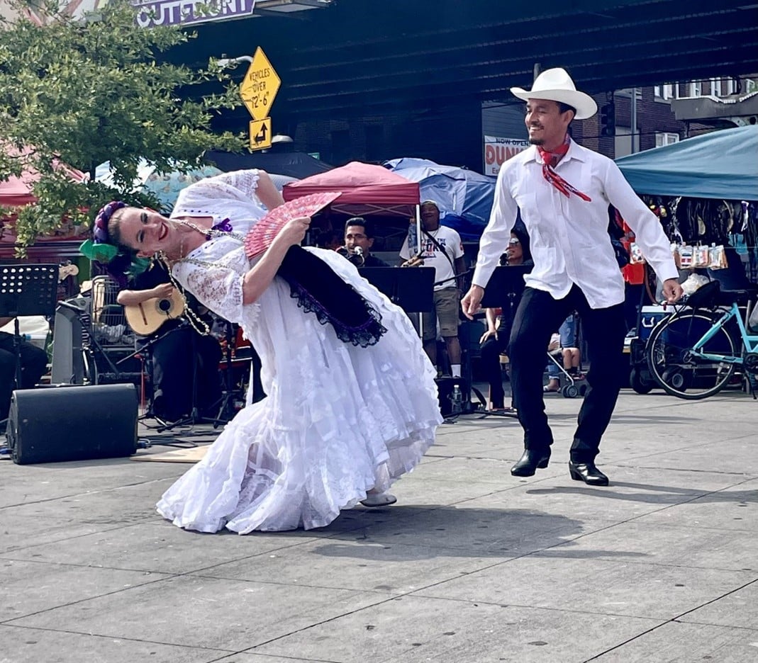 Two dancers at Corona Plaza