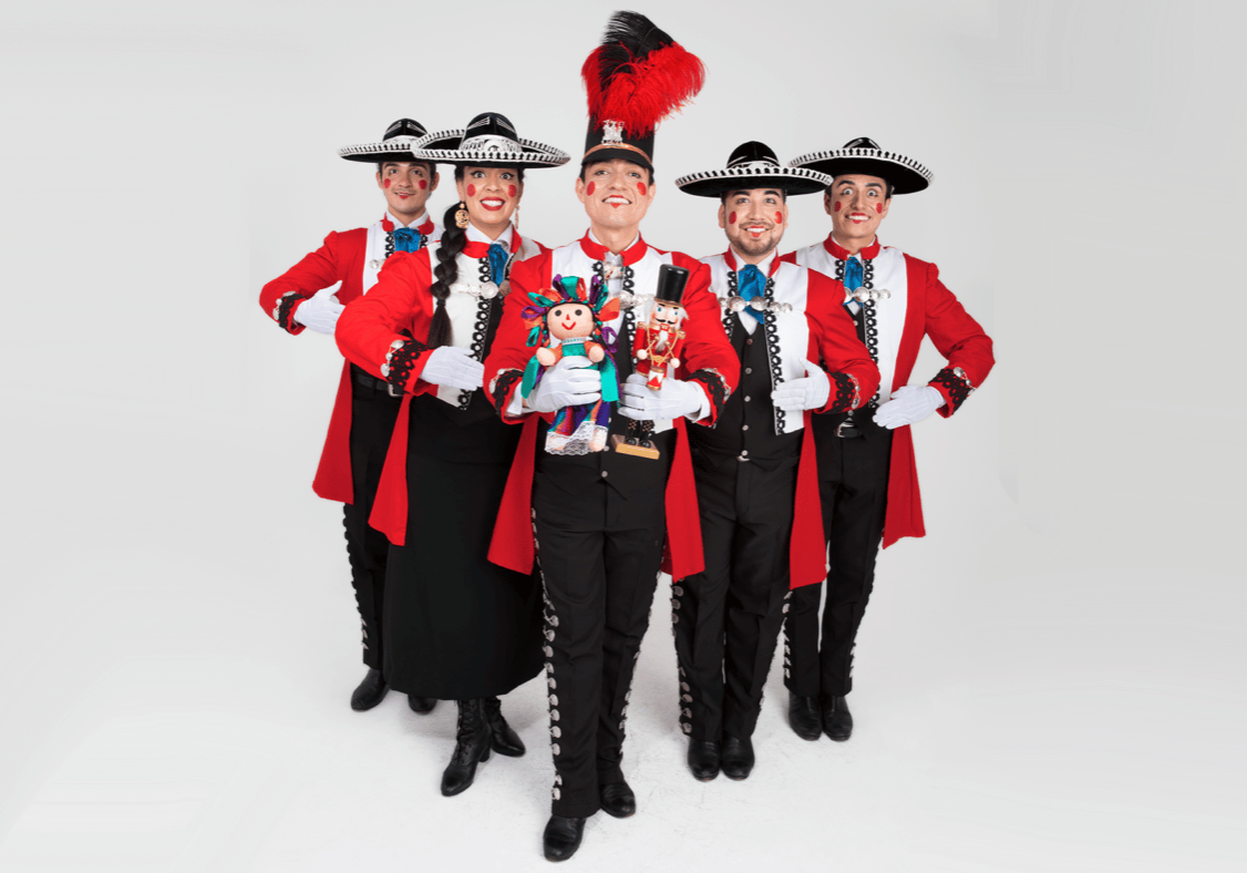 Five dancers dressed as Mexican-style nutcrackers against a white background