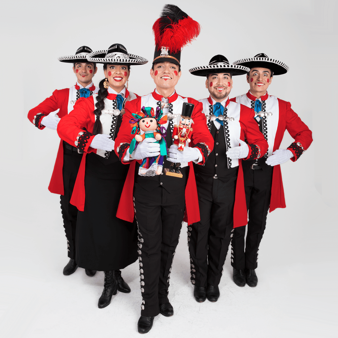 Five dancers dressed as Mexican-style nutcrackers against a white background